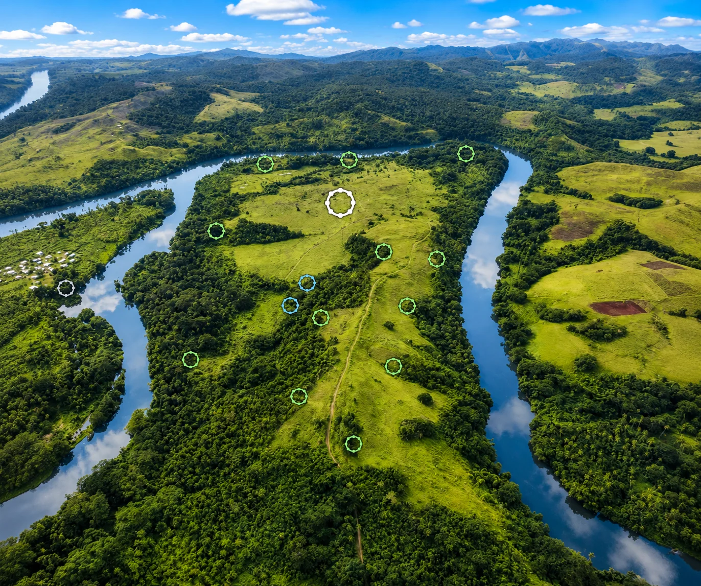 Aerial view of the estate on its river peninsula, with markers for the Sky Circle, star domes, bamboo cabins and Nakanacagi Village